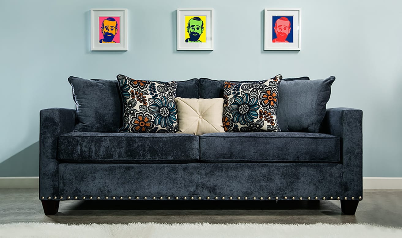 Blue sofa against blue wall.