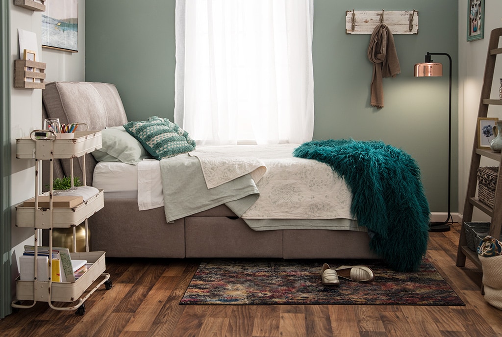 Small bedroom with bed.