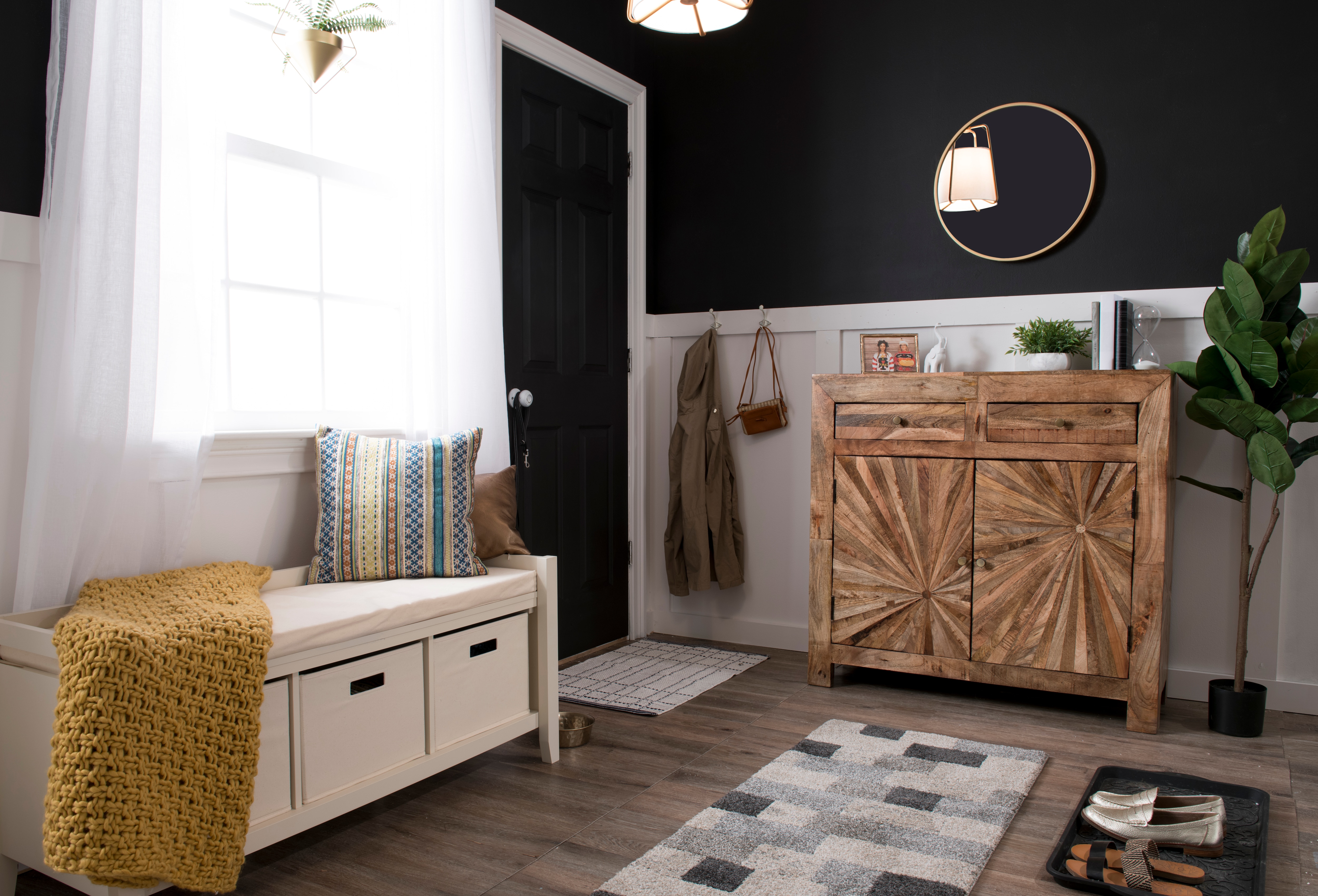 Small white bench with storage in entryway.