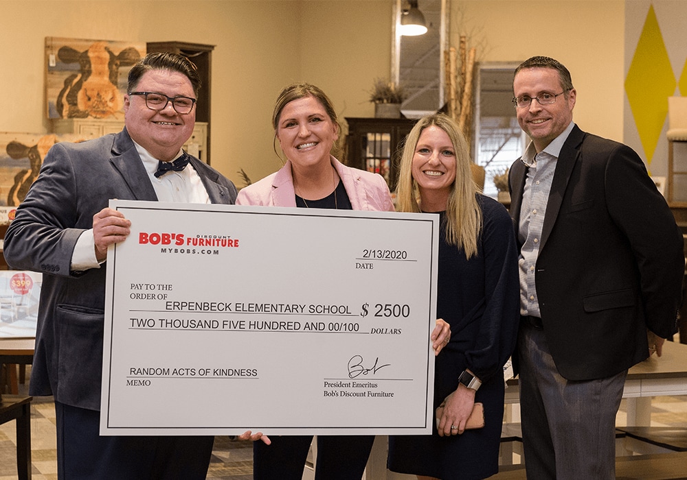 Bob's Discount Furniture presents a $2,500 Random Act of Kindness check to Erpenbeck Elementary School.