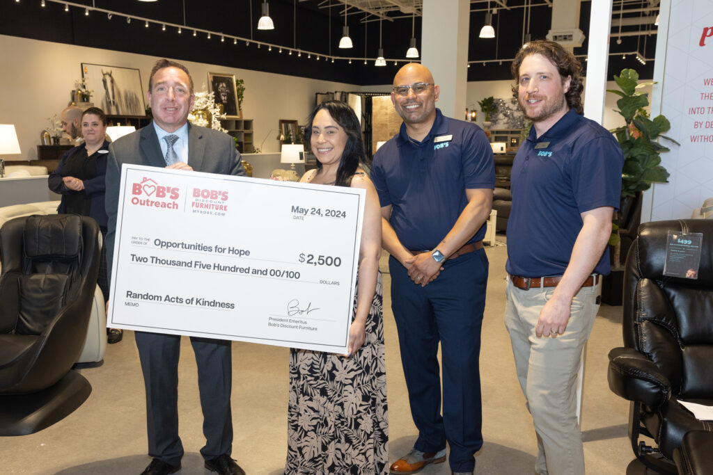 Bob’s Discount Furniture presented a $2,500 Random Acts of Kindness donation to Opportunities for Hope, representing their commitment to supporting the community. Ada Alvarado, Director of Shelter Services and Doug Bushman, Executive Director, Fitchburg Housing Authority, accepted the donation from Store manager Hector Alverez.