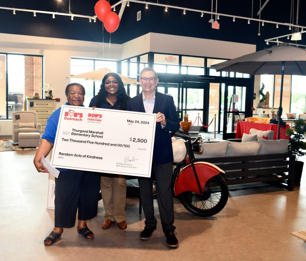 Bob’s Discount Furniture presented a $2,500 Random Acts of Kindness donation to Thurgood Marshall Elementary School, representing their commitment to supporting local schools. Avelyn Chambers, Social Worker (left), accepted the donation from store manager Casandra Byrd (center) and Bill Barton, President & CEO Bob’s Discount Furniture (right).