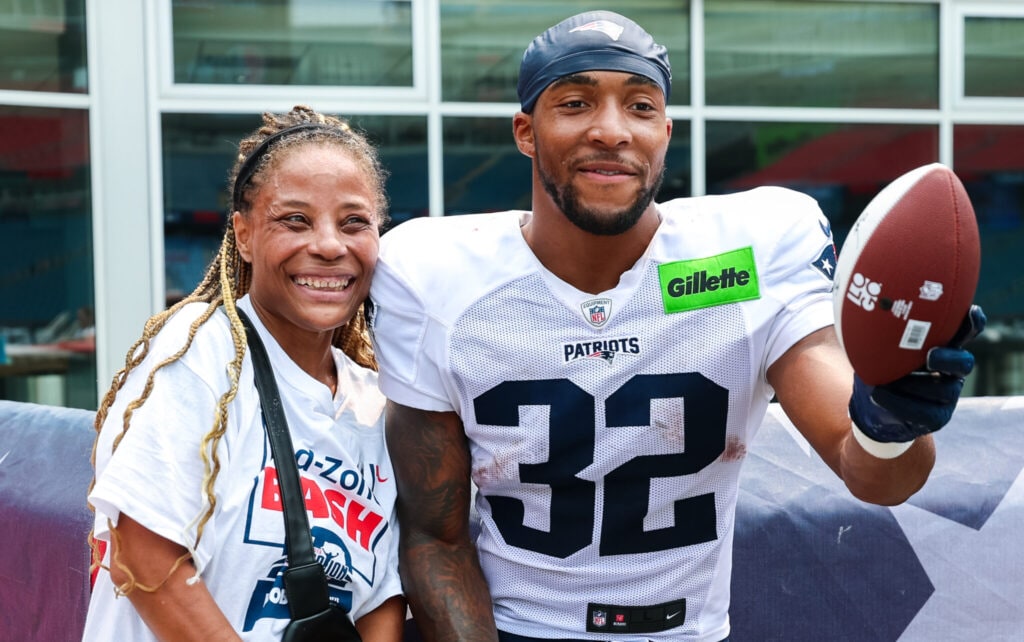TreyVeyon Henderson, Running Back poses with attendee of the Bed-Zone Bash. Courtesy of the New England Patriots.