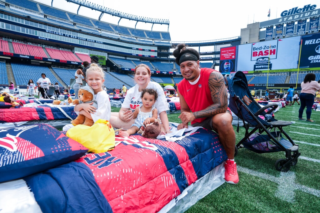 Jahlani Tavai, Linebacker, poses with attendees of the Bed-Zone Bash. Courtesy of the New England Patriots.