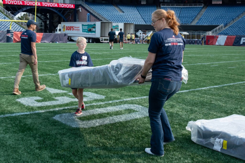 Volunteers from the New England Patriots Foundation helping out at the Bed-Zone Bash.